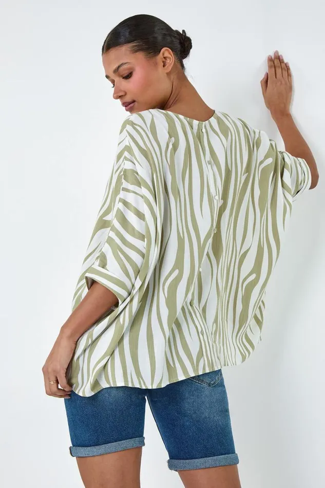 Women Ivory Animal Button Back Batwing Top Roman Tops