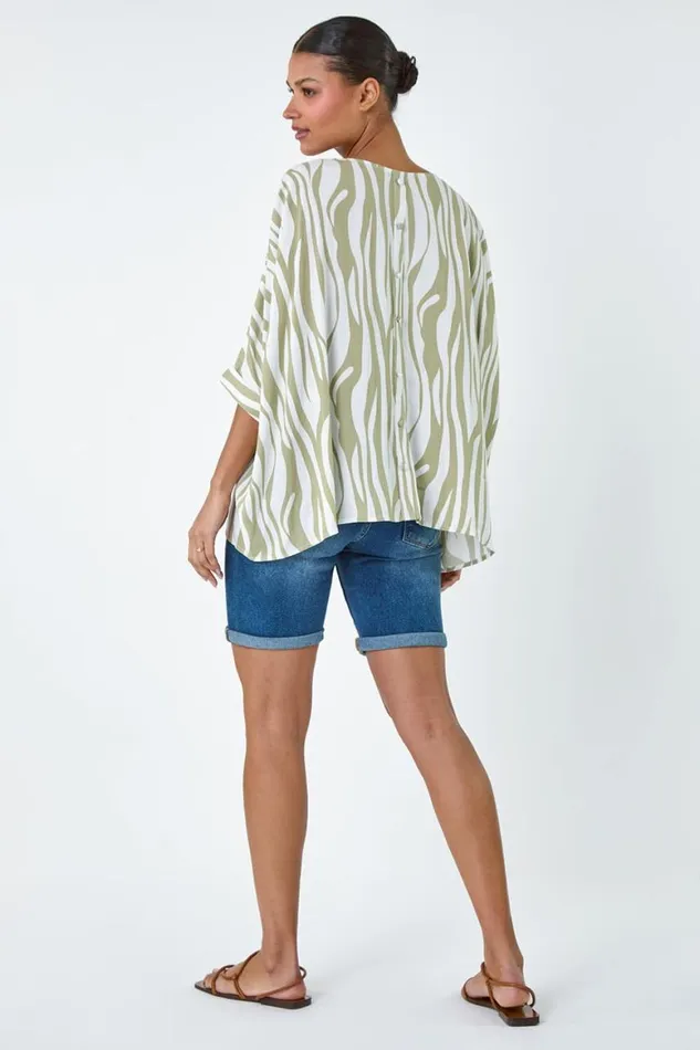 Women Ivory Animal Button Back Batwing Top Roman Tops