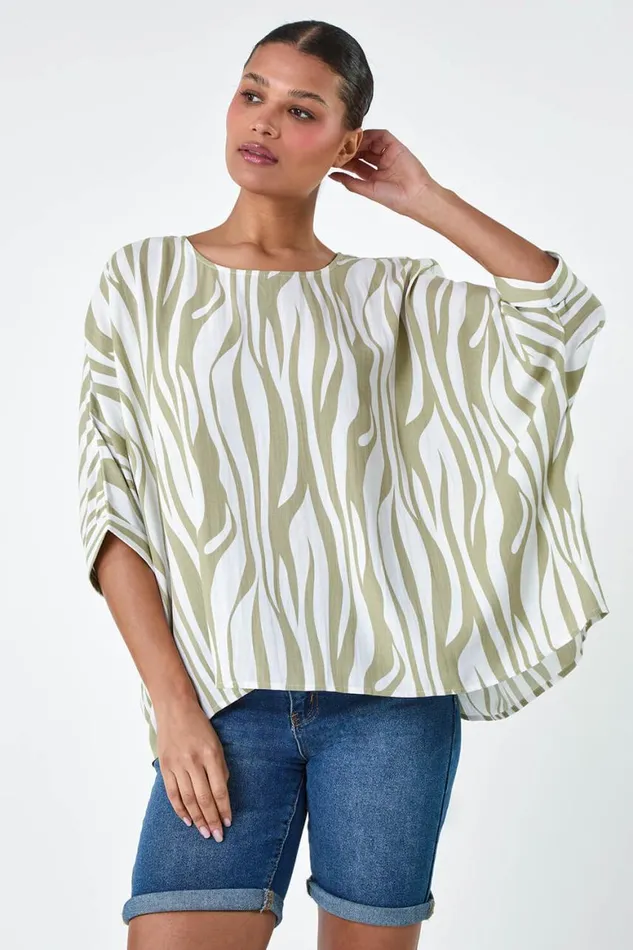 Women Ivory Animal Button Back Batwing Top Roman Tops